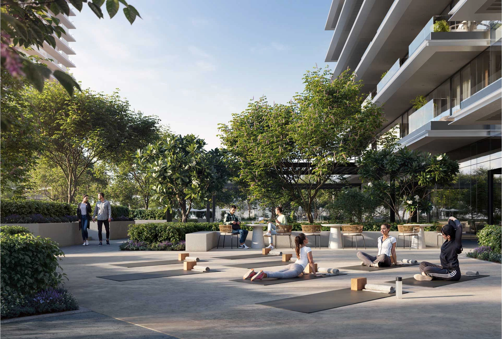 MLush landscaping and pedestrian-friendly pathways outside Albero homesodern façade of Albero with vertical greenery and earthy tones